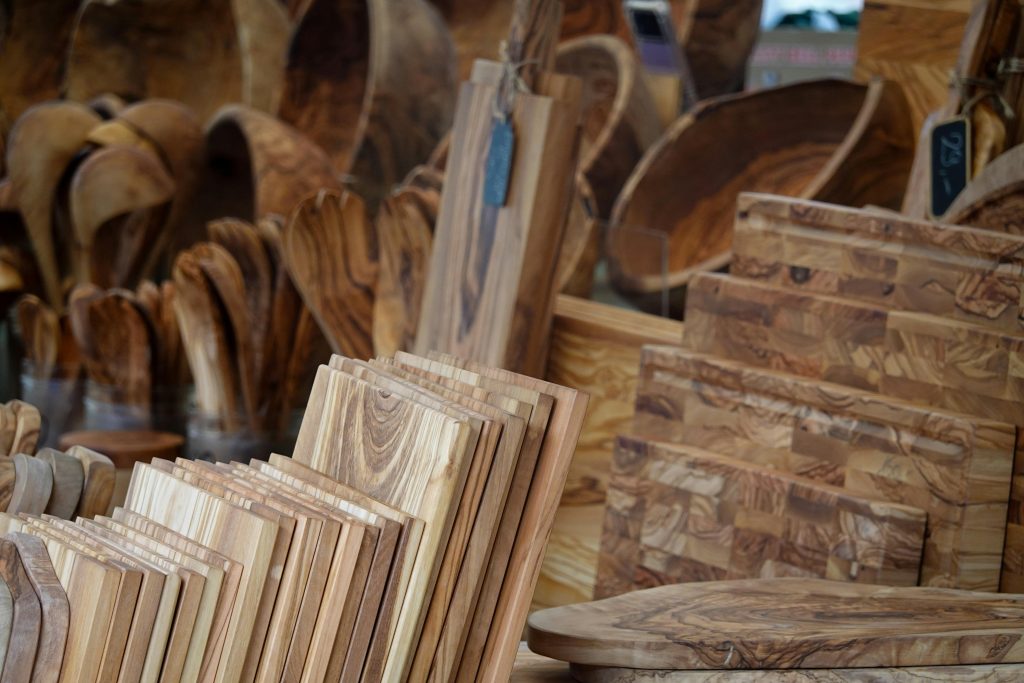 A collection of rustic kitchenware made from carved wood, ideal for home decor and culinary use.